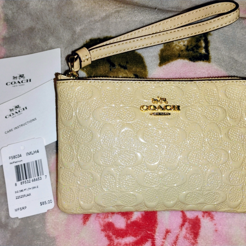 Coach Beige Embossed Wristlet